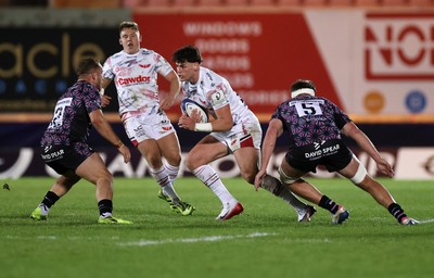 061225 - Scarlets v Bristol Bears - Investec European Champions Cup - Eddie James of Scarlets is challenged by James Williams of Bristol Bears 