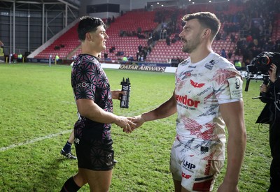 061225 - Scarlets v Bristol Bears - Investec European Champions Cup - Louis Rees-Zammit of Bristol Bears and Johnny Williams of Scarlets at full time