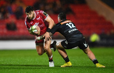 310323 - Scarlets v Brive - European Rugby Challenge Cup - Johnny Williams of Scarlets is tackled by Sam Arnold of Brive