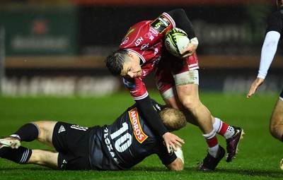 310323 - Scarlets v Brive - European Rugby Challenge Cup - Steff Evans of Scarlets is tackled by Stuart Olding of Brive