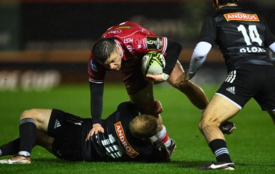 310323 - Scarlets v Brive - European Rugby Challenge Cup - Steff Evans of Scarlets is tackled by Stuart Olding of Brive