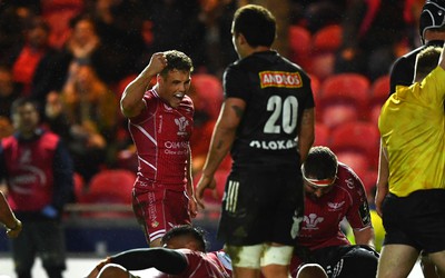 310323 - Scarlets v Brive - European Rugby Challenge Cup - Kieran Hardy of Scarlets celebrates Aaron Shingler try