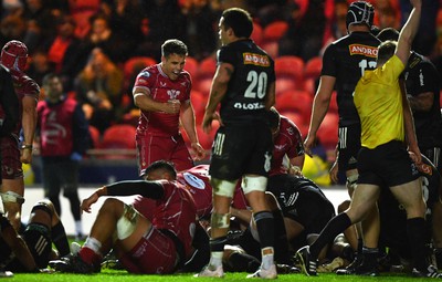 310323 - Scarlets v Brive - European Rugby Challenge Cup - Kieran Hardy of Scarlets celebrates Aaron Shingler try