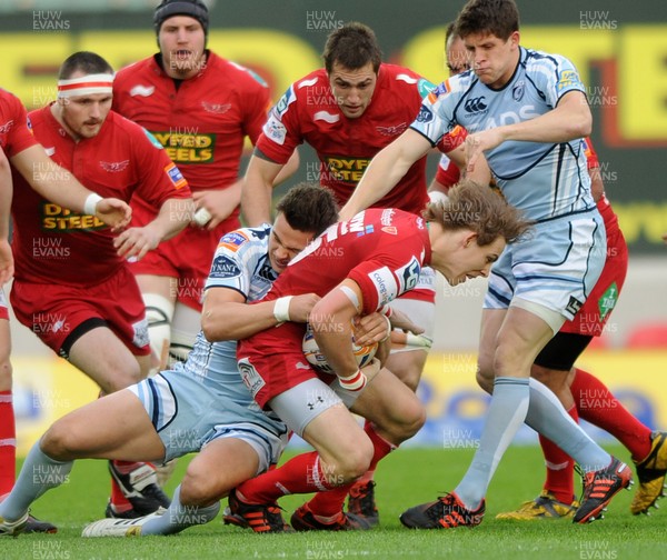 050512 - Scarlets v Cardiff Blues - RaboDirect PRO12 -Liam Williams of Scarlets is tackled by Chris Czekaj of Cardiff Blues