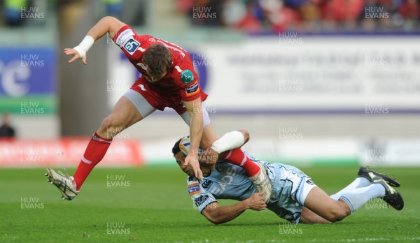 050512 - Scarlets v Cardiff Blues - RaboDirect PRO12 -Andy Fenby of Scarlets is tackled by Casey Laulala of Cardiff Blues