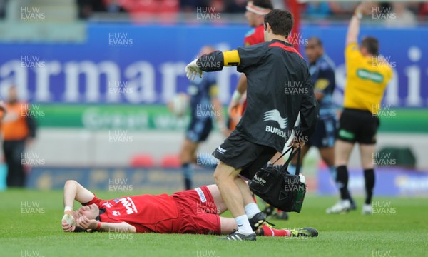 06.05.11 - Scarlets v Cardiff Blues - Magners League - Stephen Jones of Scarlets goes down in the first half. 