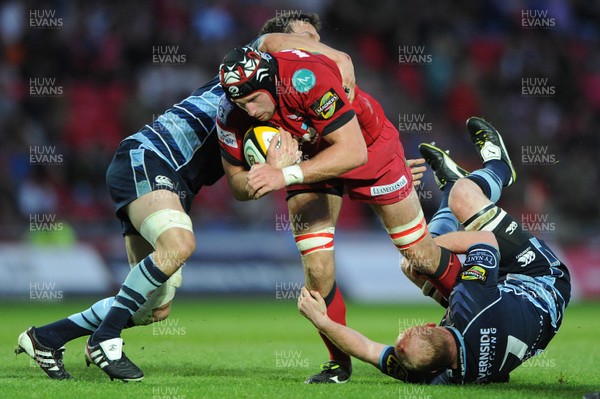 06.05.11 - Scarlets v Cardiff Blues - Magners League - Dominic Day of Scarlets is tackled by Sam Warburton and Martyn Williams of Cardiff Blues. 