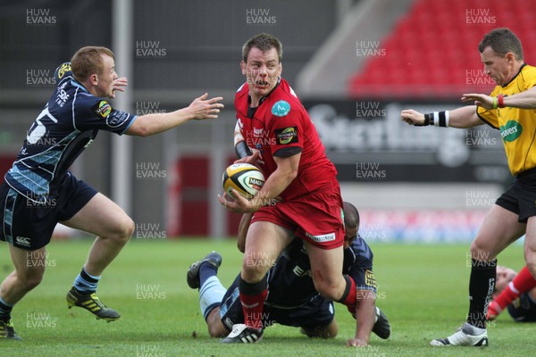 06.05.11 - Scarlets v Cardiff Blues - Magners League - Matthew Rees of Scarlets is tackled by Taufa'au Filise of Cardiff Blues. 