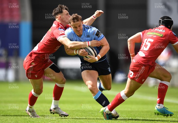 150521 - Scarlets v Cardiff Blues - Guinness PRO14 Rainbow Cup - Hallam Amos of Cardiff Blues is tackled by Tom Rogers of Scarlets