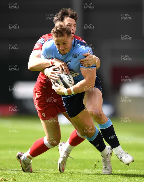 150521 - Scarlets v Cardiff Blues - Guinness PRO14 Rainbow Cup - Hallam Amos of Cardiff Blues is tackled by Tom Rogers of Scarlets
