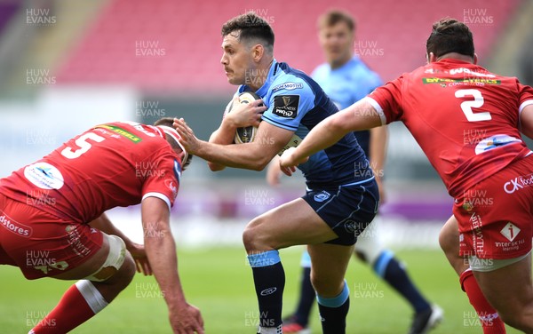150521 - Scarlets v Cardiff Blues - Guinness PRO14 Rainbow Cup - Tomos Williams of Cardiff Blues takes on Lewis Rawlins of Scarlets
