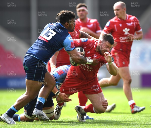 150521 - Scarlets v Cardiff Blues - Guinness PRO14 Rainbow Cup - Rob Evans of Scarlets is tackled by Willis Halaholo of Cardiff Blues