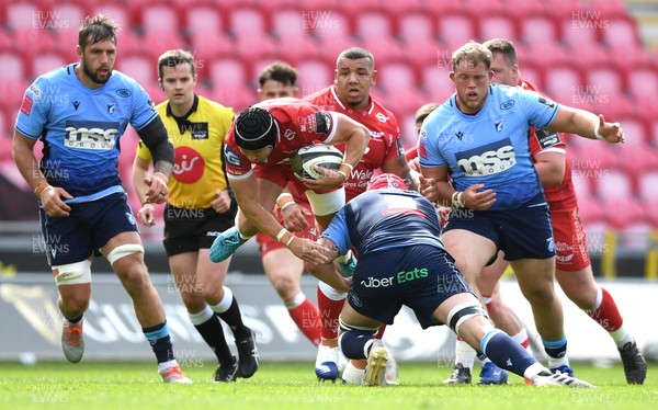 150521 - Scarlets v Cardiff Blues - Guinness PRO14 Rainbow Cup - Leigh Halfpenny of Scarlets is tackled by Cory Hill of Cardiff Blues