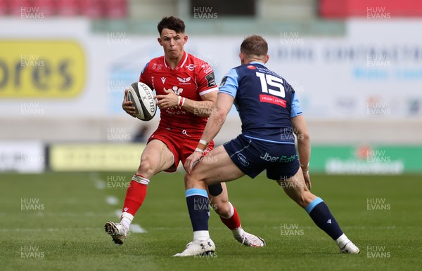 150521 - Scarlets v Cardiff Blues - Guinness PRO14 Rainbow Cup - Tom Rogers of Scarlets is tackled by Hallam Amos of Cardiff Blues
