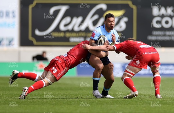 150521 - Scarlets v Cardiff Blues - Guinness PRO14 Rainbow Cup - Willis Halaholo Cardiff Blues is tackled by Jonathan Davies and Josh Helps of Scarlets