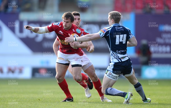 200413 - Scarlets v Cardiff Blues - RaboDirect PRO12 -Andy Fenby of Scarlets is tackled by Owen Williams of Cardiff Blues 