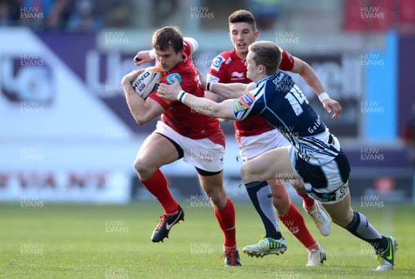 200413 - Scarlets v Cardiff Blues - RaboDirect PRO12 -Andy Fenby of Scarlets is tackled by Owen Williams of Cardiff Blues 