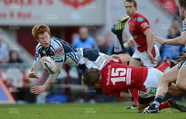 200413 - Scarlets v Cardiff Blues - RaboDirect PRO12 -Rhys Patchell of Cardiff Blues is tackled by Liam Williams of Scarlets 