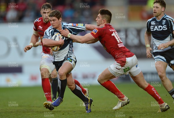 200413 - Scarlets v Cardiff Blues - RaboDirect PRO12 -Harry Robinson of Cardiff Blues is tackled by Owen Williams of Scarlets 