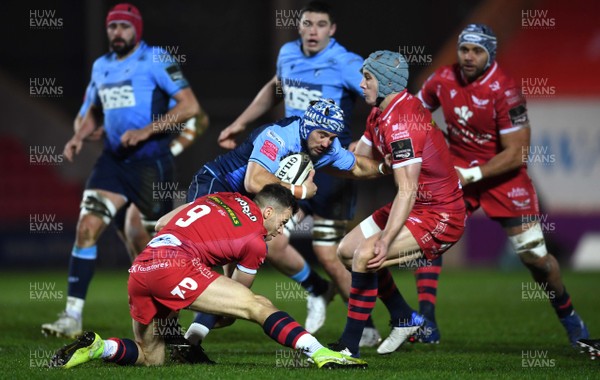 220121 - Scarlets v Cardiff Blues - Guinness PRO14 - Matthew Morgan of Cardiff Blues is tackled by Gareth Davies of Scarlets
