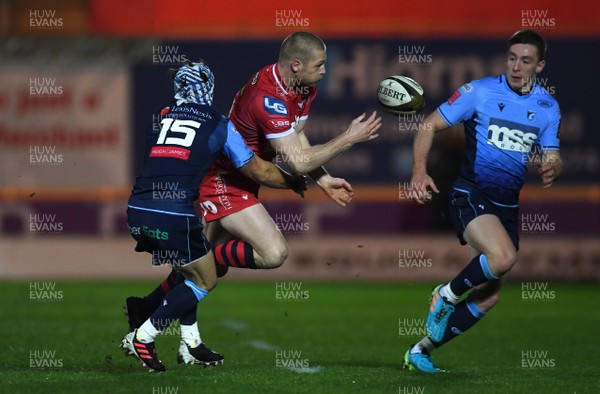 220121 - Scarlets v Cardiff Blues - Guinness PRO14 - Johnny McNicholl of Scarlets is tackled by Matthew Morgan of Cardiff Blues