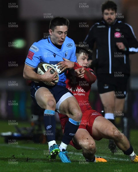220121 - Scarlets v Cardiff Blues - Guinness PRO14 - Josh Adams of Cardiff Blues is tackled by Steff Evans of Scarlets