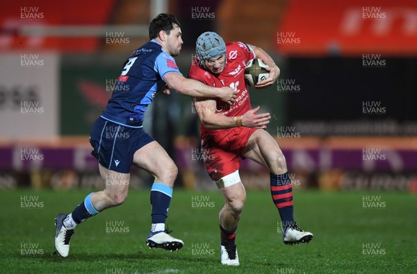 220121 - Scarlets v Cardiff Blues - Guinness PRO14 - Jonathan Davies of Scarlets is tackled by Tomos Williams of Cardiff Blues