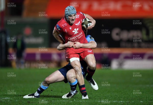 220121 - Scarlets v Cardiff Blues - Guinness PRO14 - Jonathan Davies of Scarlets is tackled by Tomos Williams of Cardiff Blues