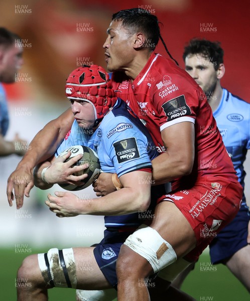 220121 - Scarlets v Cardiff Blues - Guinness PRO14 - James Botham of Cardiff Blues is tackled by Sam Lousi of Scarlets