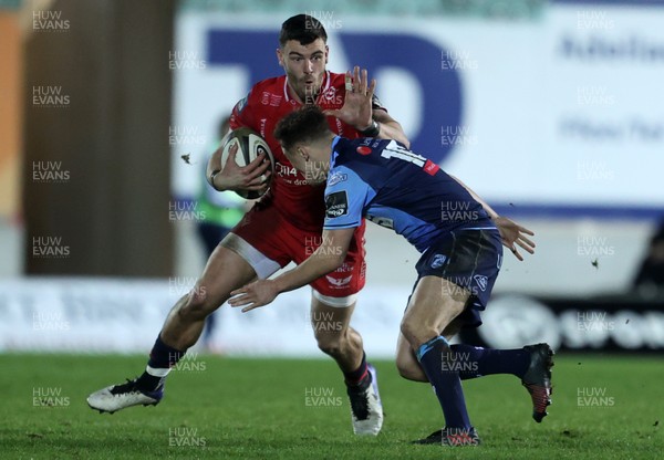220121 - Scarlets v Cardiff Blues - Guinness PRO14 - Johnny Williams of Scarlets is tackled by Jarrod Evans of Cardiff Blues