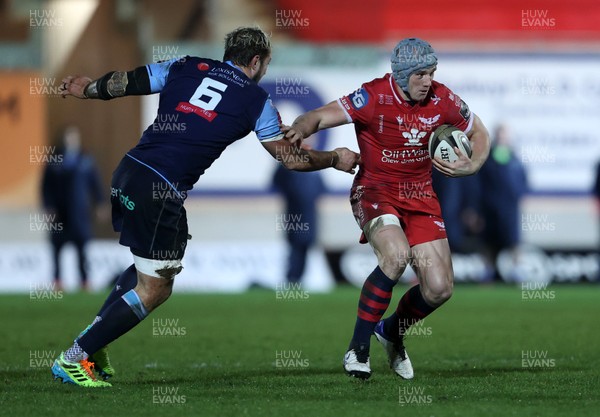 220121 - Scarlets v Cardiff Blues - Guinness PRO14 - Jonathan Davies of Scarlets is tackled by Josh Turnbull of Cardiff Blues