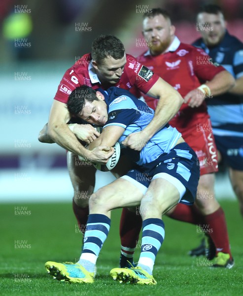 291218 - Scarlets v Cardiff Blues - Guinness PRO14 - Lloyd Williams of Cardiff Blues is tackled by Tom Prydie of Scarlets
