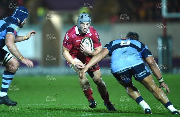 291218 - Scarlets v Cardiff Blues - Guinness PRO14 - Jonathan Davies of Scarlets is tackled by Nick Williams of Cardiff Blues