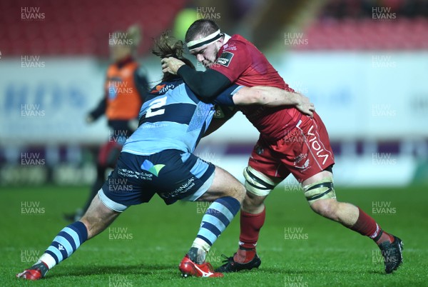 291218 - Scarlets v Cardiff Blues - Guinness PRO14 - Will Boyde of Scarlets is tackled by Kristian Dacey of Cardiff Blues