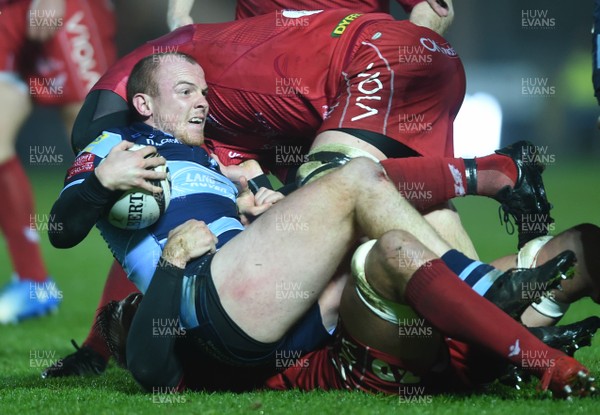 291218 - Scarlets v Cardiff Blues - Guinness PRO14 - Dan Fish of Cardiff Blues is tackled by David Bulbring of Scarlets