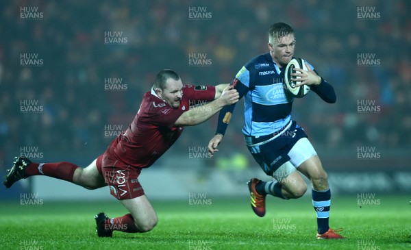 291218 - Scarlets v Cardiff Blues - Guinness PRO14 - Gareth Anscombe of Cardiff Blues is tackled by Ken Owens of Scarlets