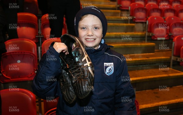 291218 - Scarlets v Cardiff Blues - Guinness PRO14 - Young Blues fan Ben, aged 10 with Nick Williams playing boots, who gave them to him after the game