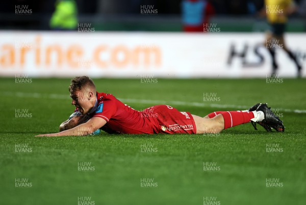 020422 - Scarlets v Cardiff Rugby - United Rugby Championship - Sam Costelow of Scarlets dives over the line to score a try