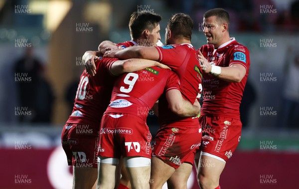 020422 - Scarlets v Cardiff Rugby - United Rugby Championship - Sam Costelow of Scarlets celebrates scoring a try with team mates