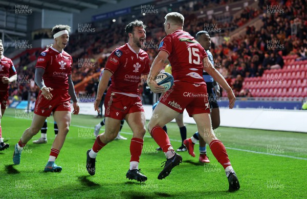 020422 - Scarlets v Cardiff Rugby - United Rugby Championship - Johnny McNicholl of Scarlets celebrates scoring a try with Ryan Conbeer