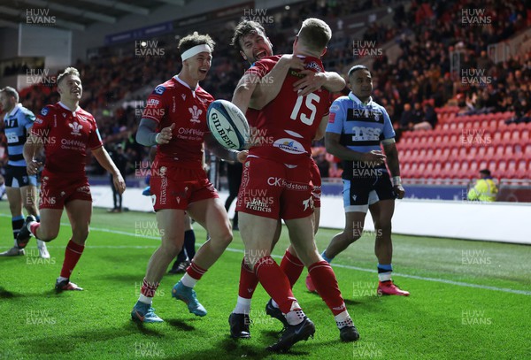 020422 - Scarlets v Cardiff Rugby - United Rugby Championship - Johnny McNicholl of Scarlets celebrates scoring a try with Ryan Conbeer