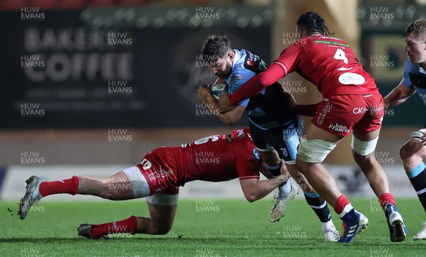 020422 - Scarlets v Cardiff Rugby - United Rugby Championship - Kirby Myhill of Cardiff is tackled by Ryan Elias of Scarlets