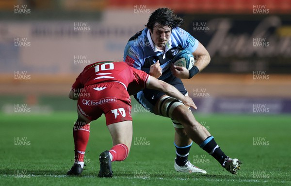 020422 - Scarlets v Cardiff Rugby - United Rugby Championship - Rory Thornton of Cardiff is tackled by Sam Costelow of Scarlets