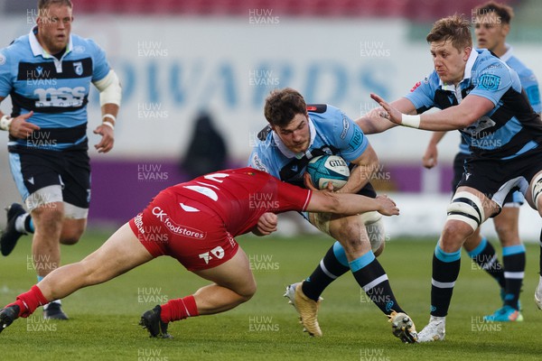 020422 - Scarlets v Cardiff Rugby - United Rugby Championship - James Ratti of Cardiff Rugby is tackled by Shaun Evans of Scarlets