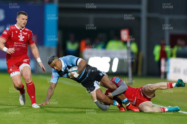020422 - Scarlets v Cardiff Rugby - United Rugby Championship - Rey Lee-Lo of Cardiff Rugby is tackled by Tom Rogers of Scarlets
