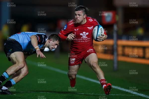 041123 - Scarlets v Cardiff Rugby - United Rugby Championship - Steff Evans of Scarlets is tackled by Harri Millard of Cardiff