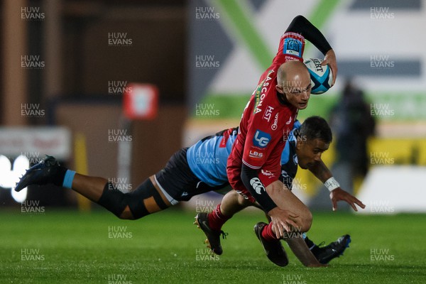 041123 - Scarlets v Cardiff Rugby - United Rugby Championship - Ioan Nicholas of Scarlets is tackled by Rey Lee-Lo of Cardiff
