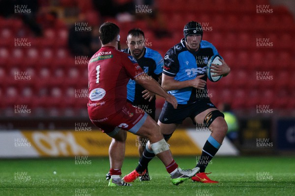 041123 - Scarlets v Cardiff Rugby - United Rugby Championship - Seb Davies of Cardiff takes on Kemsley Mathias of Scarlets