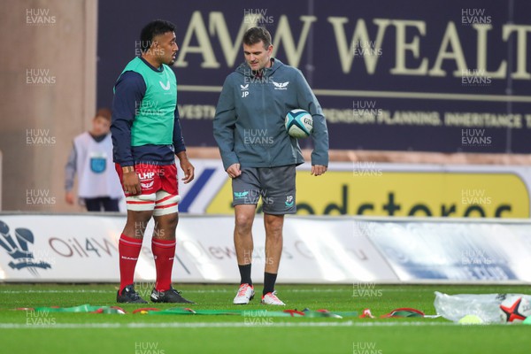 041123 - Scarlets v Cardiff Rugby - United Rugby Championship - Carwyn Tuipulotu of Scarlets and Jared Payne attack coach before kick off
