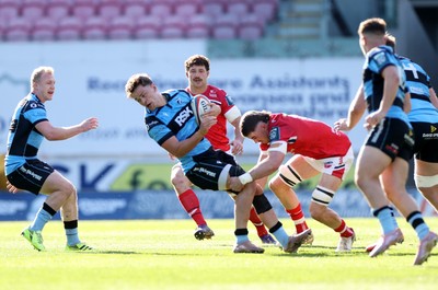 180426 - Scarlets v Cardiff Rugby - United Rugby Championship - Alex Mann of Cardiff is tackled by Fletcher Anderson of Scarlets 